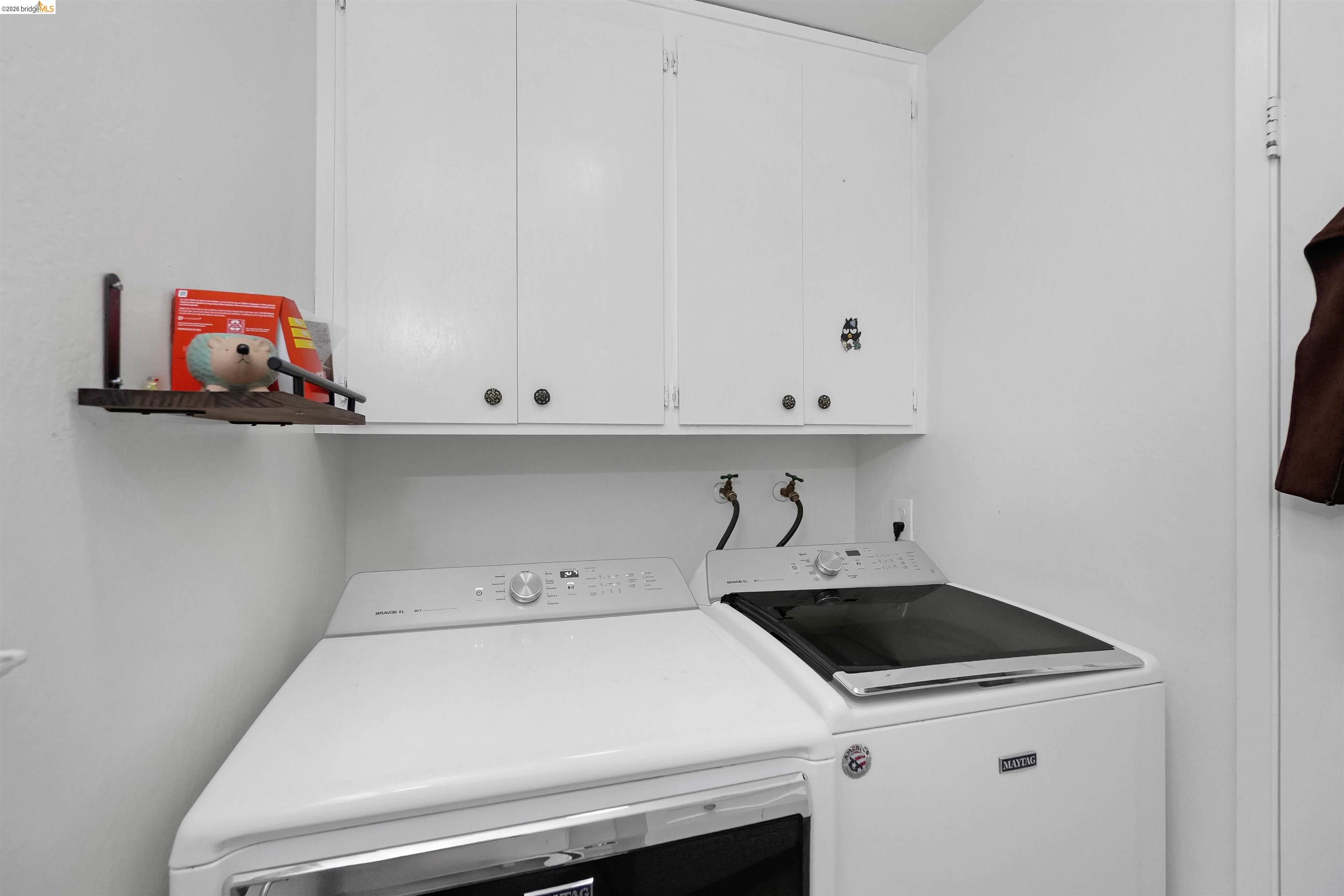 1066 San Miguel Road Concord, CA 94518 - Photo 23 of 59 Laundry room with washer and dryer and cabinet space
