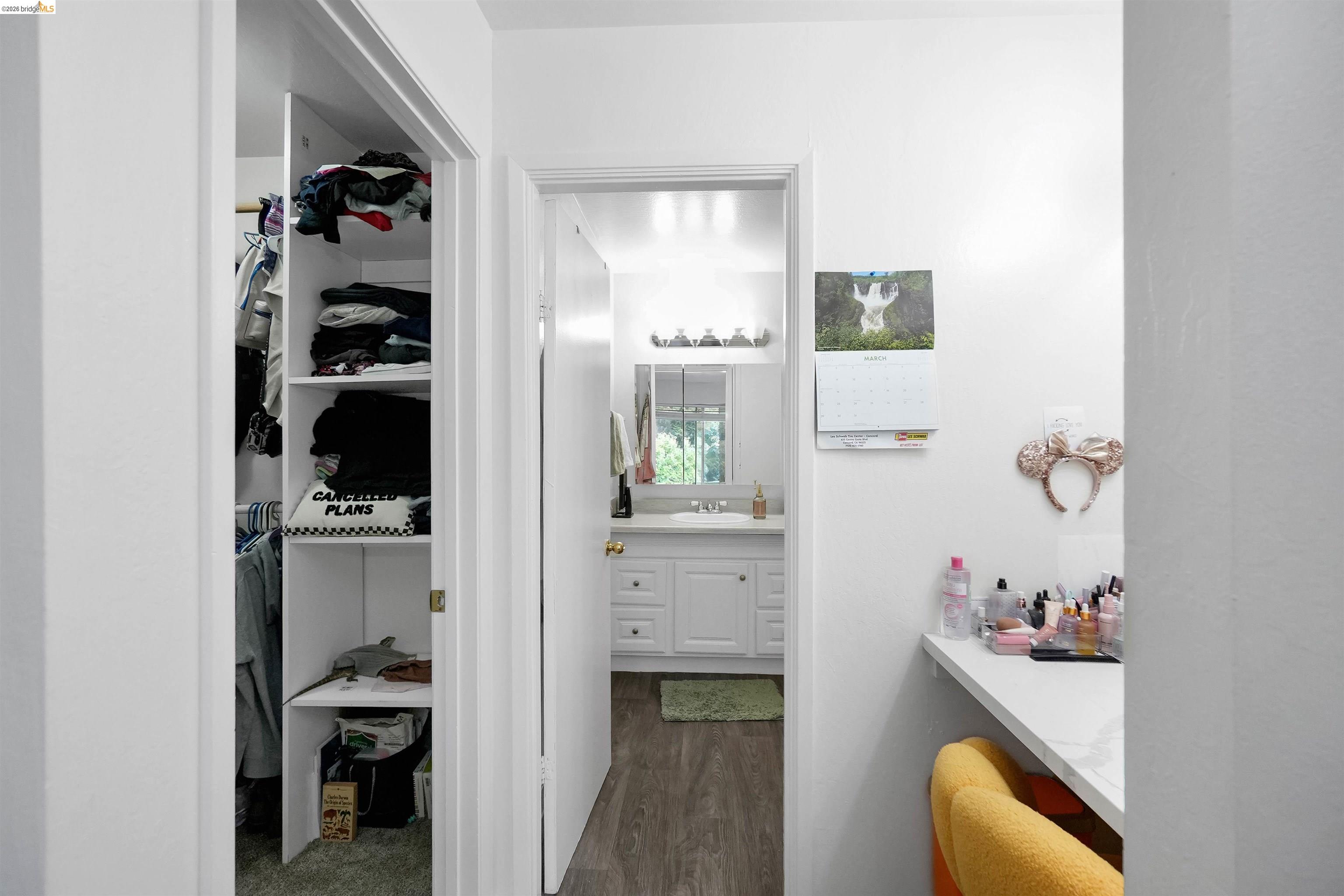 1066 San Miguel Road Concord, CA 94518 - Photo 28 of 59 Bathroom featuring vanity, walk-in closet in primary bedroom, access to hall bathroom