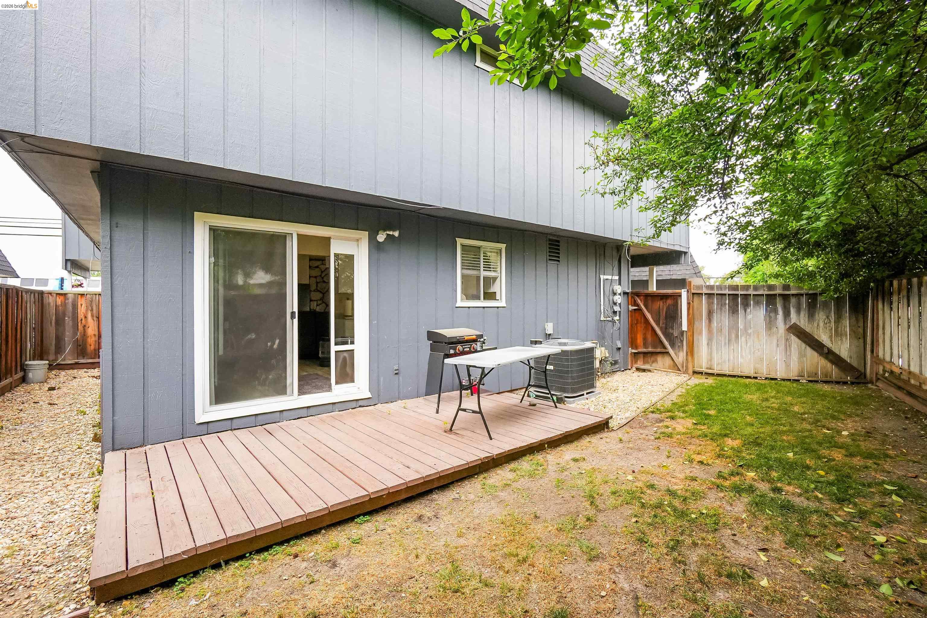 1066 San Miguel Road Concord, CA 94518 - Photo 34 of 59 Rear view of house featuring a fenced backyard, a gate, and a wooden deck