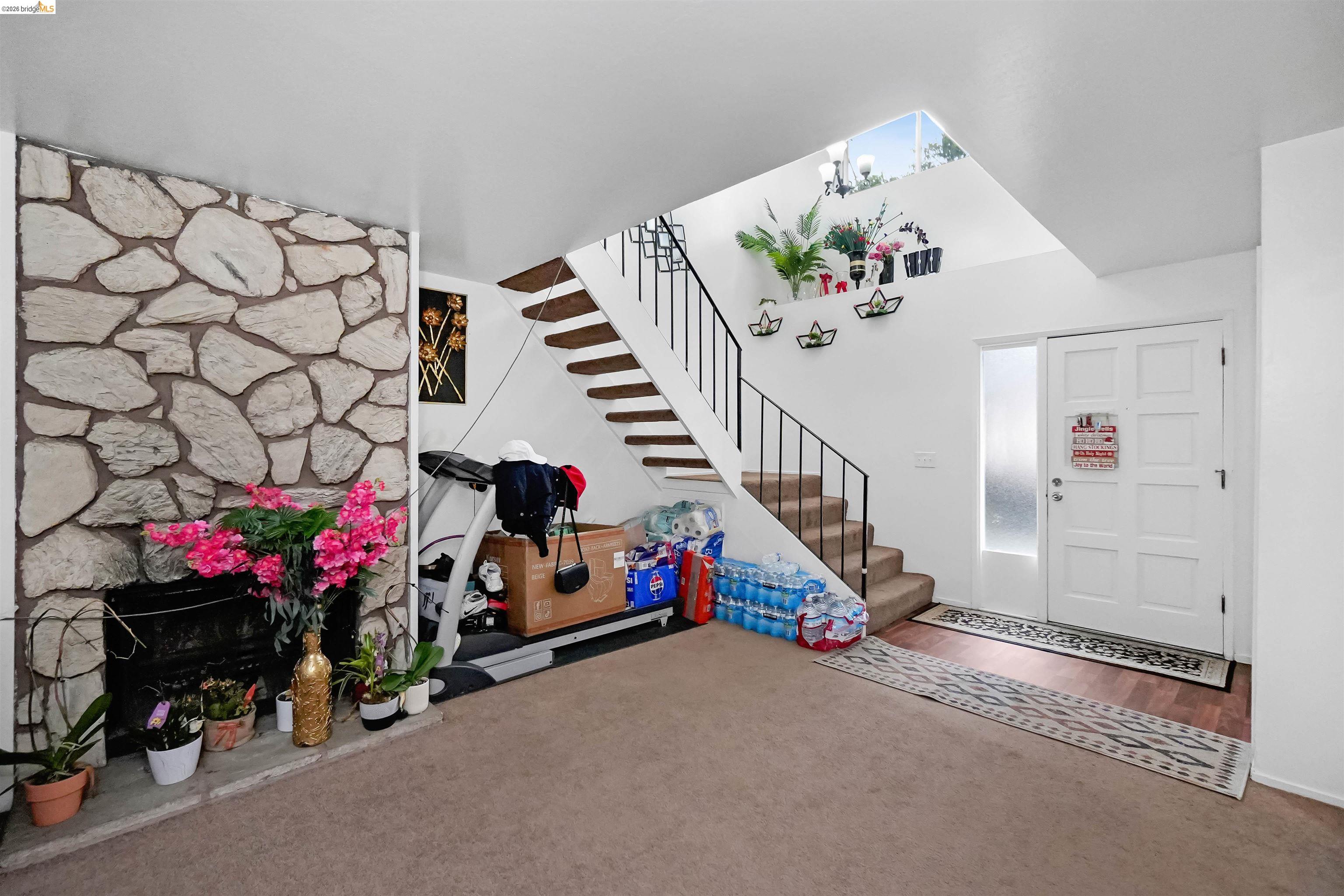 1066 San Miguel Road Concord, CA 94518 - Photo 39 of 59 Foyer entrance with carpet floors and a stone fireplace