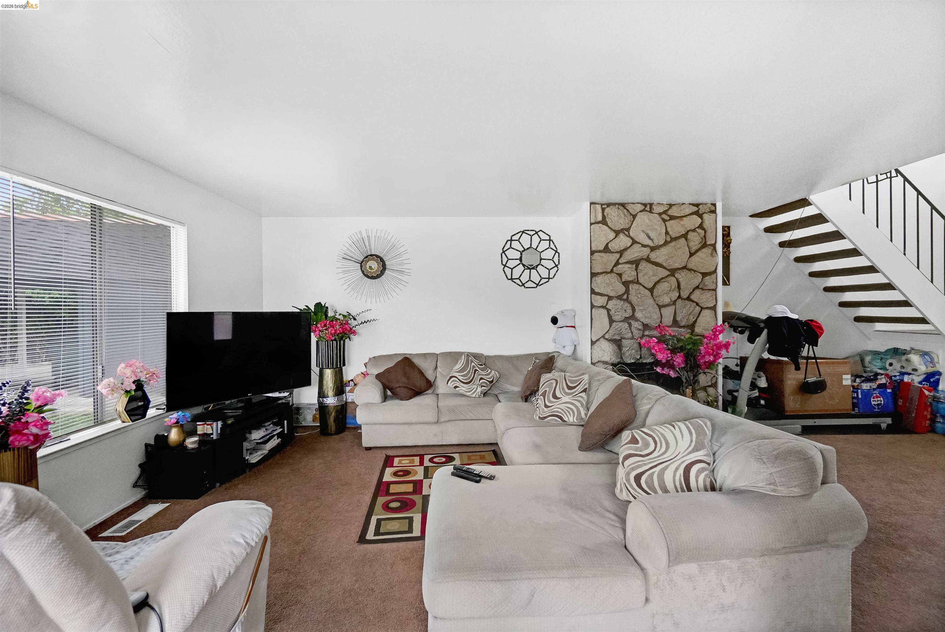 1066 San Miguel Road Concord, CA 94518 - Photo 42 of 59 Carpeted living area featuring stairway