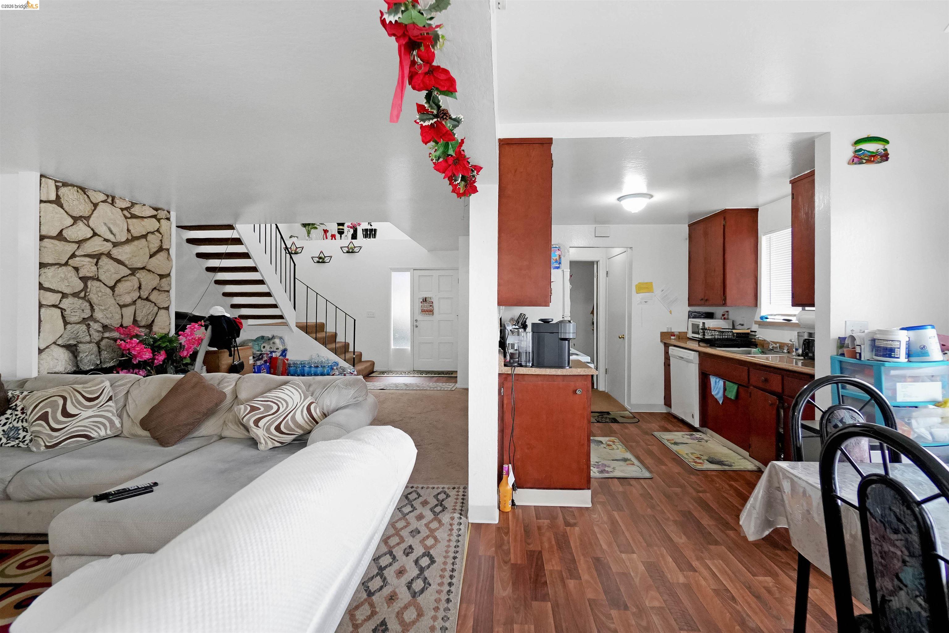 1066 San Miguel Road Concord, CA 94518 - Photo 43 of 59 Living room with dark wood-style flooring and stairs