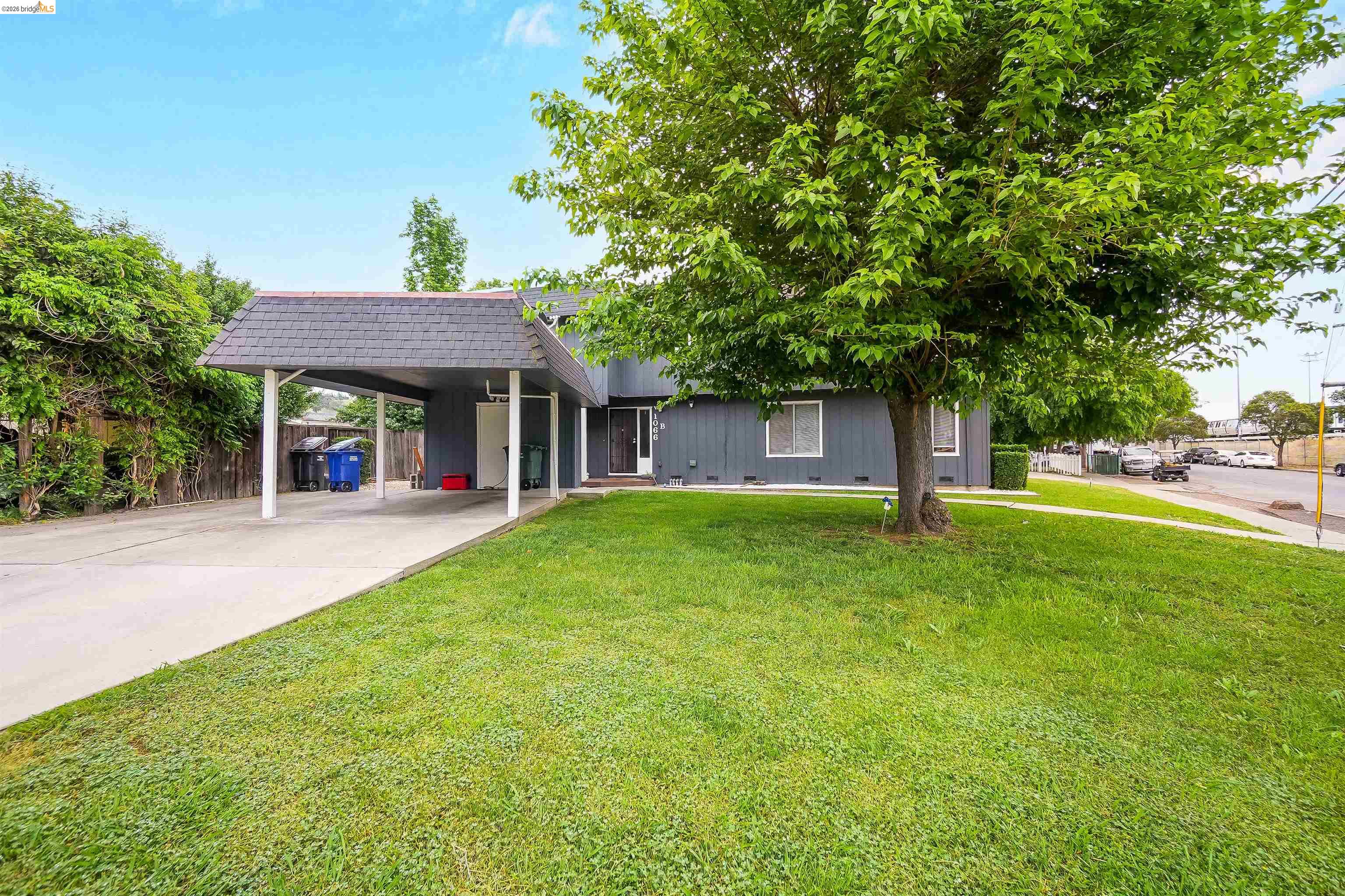 1066 San Miguel Road Concord, CA 94518 - Photo 7 of 59 View of front of property with a carport, concrete driveway, mansard roof, and roof with shingles