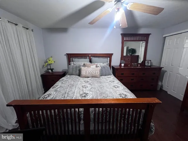 a bed room with a bed and a dresser