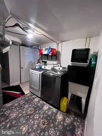 a large bed sitting in a room next to a window