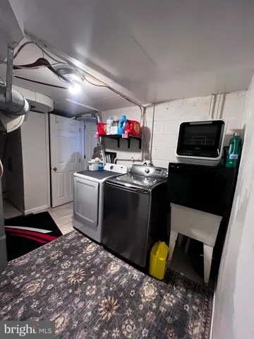 a large bed sitting in a room next to a window