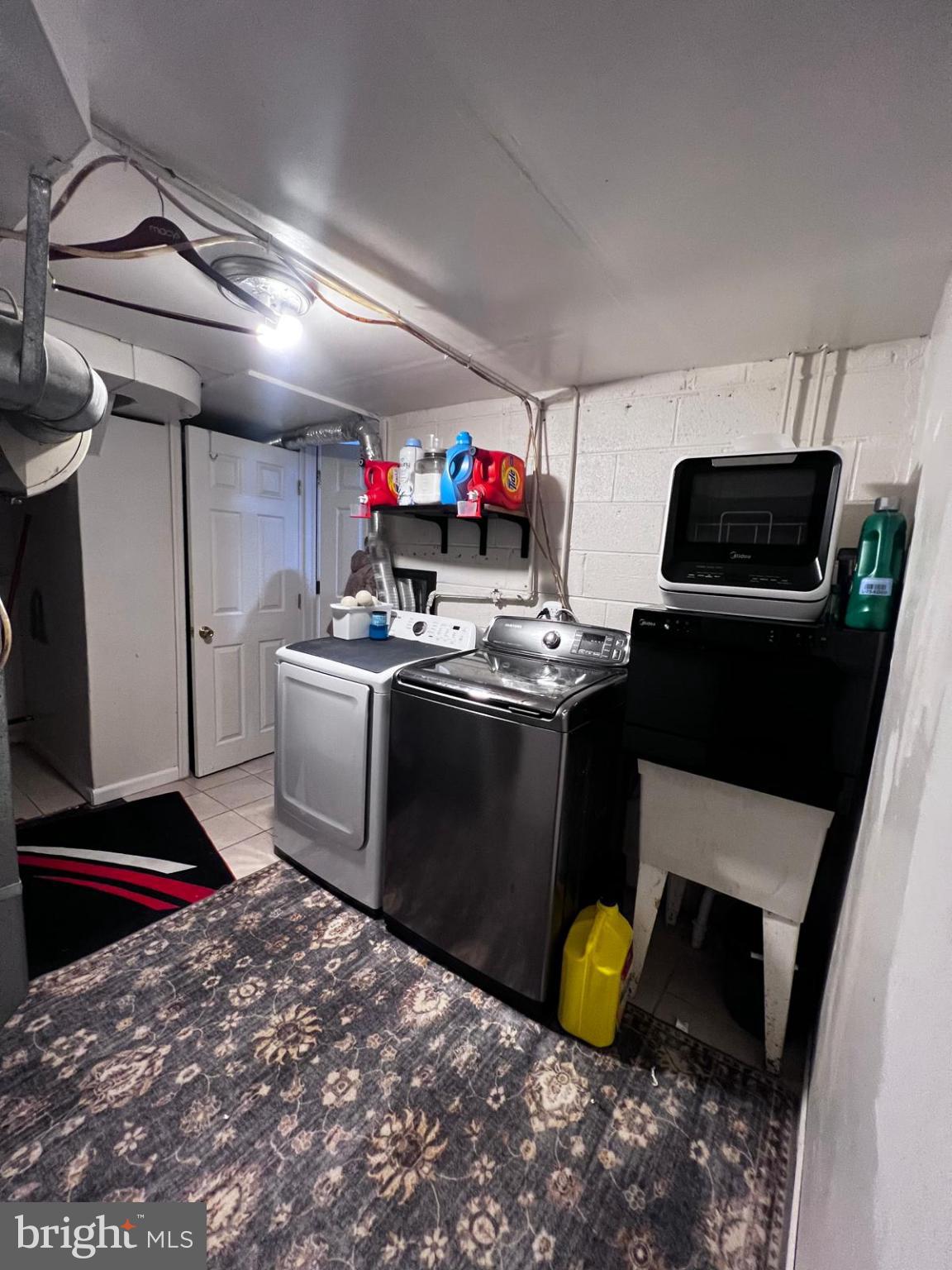 12715 Cabell Road Philadelphia, PA 19154 - Photo 26 of 33 Functional laundry space with modern appliances.