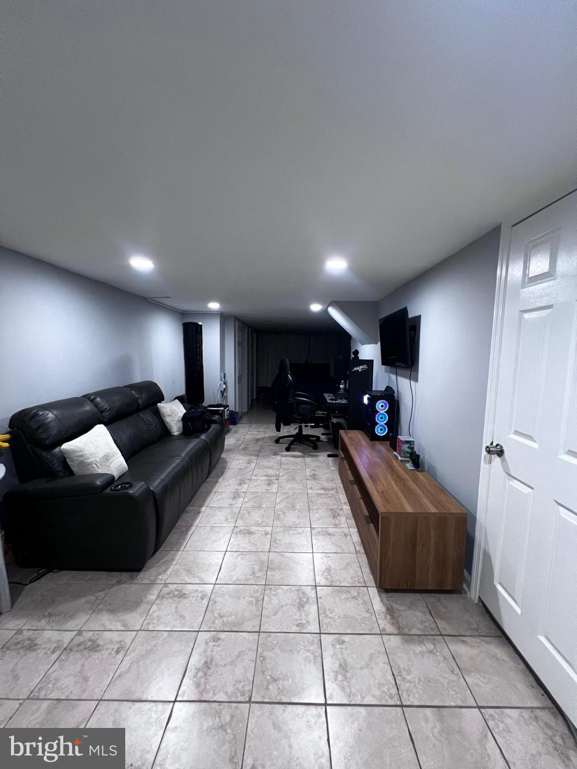 12715 Cabell Road Philadelphia, PA 19154 - Photo 27 of 33 Modern basement retreat with sleek design.