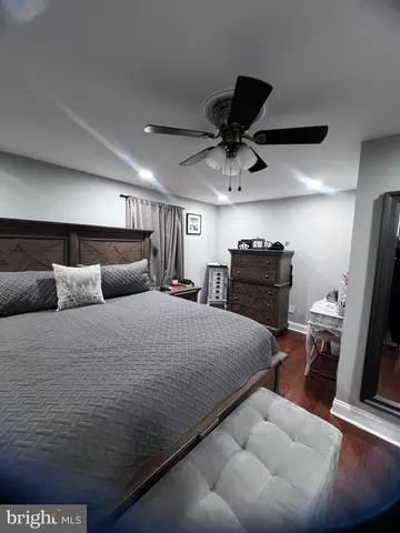 a bedroom with a bed and a television