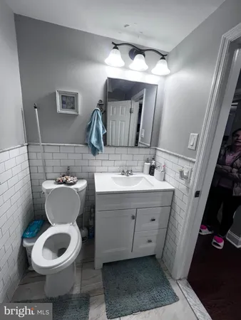 a bedroom with a bed and a mirror