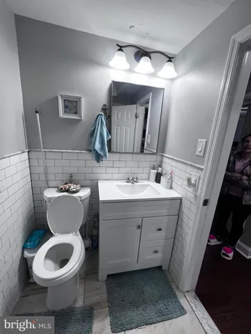 a bedroom with a bed and a mirror