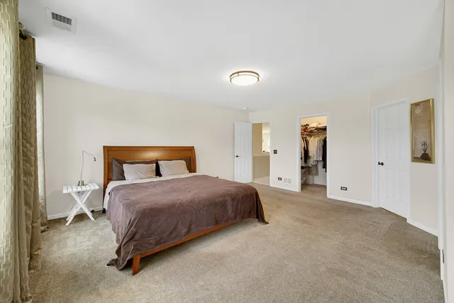 a bedroom with a bed and closet