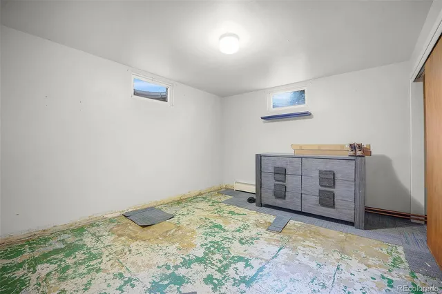 a bedroom with a bed and cabinets