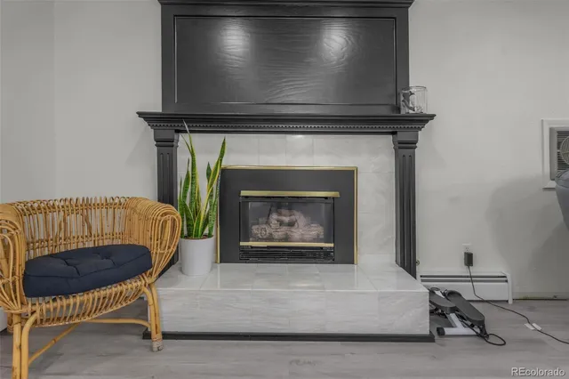 a living room with a fireplace and a table