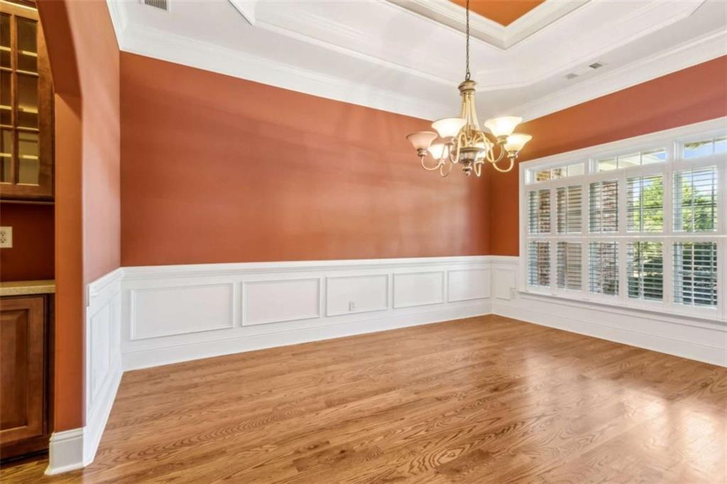 94 Appalachee Church Road Auburn, GA 30011 - Photo 11 of 66 a view of an empty room with a window and chandelier fan