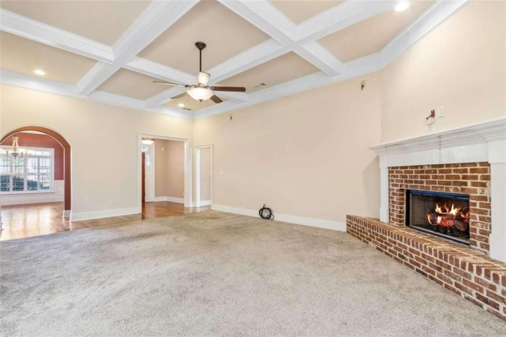 94 Appalachee Church Road Auburn, GA 30011 - Photo 15 of 66 an empty room with fireplace and fan