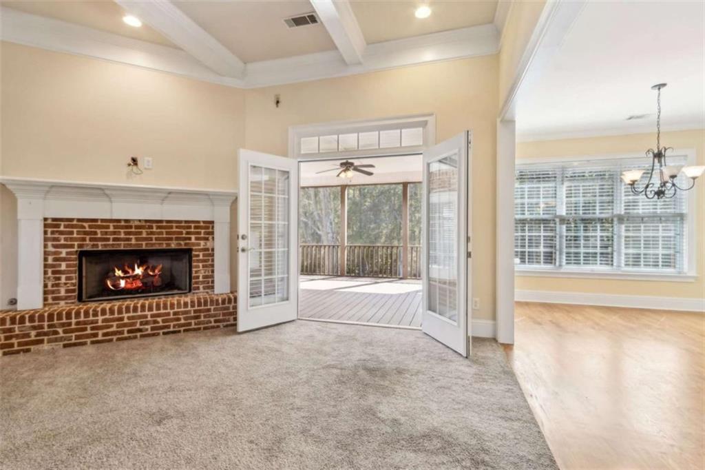 94 Appalachee Church Road Auburn, GA 30011 - Photo 19 of 66 a living room with furniture and a fireplace