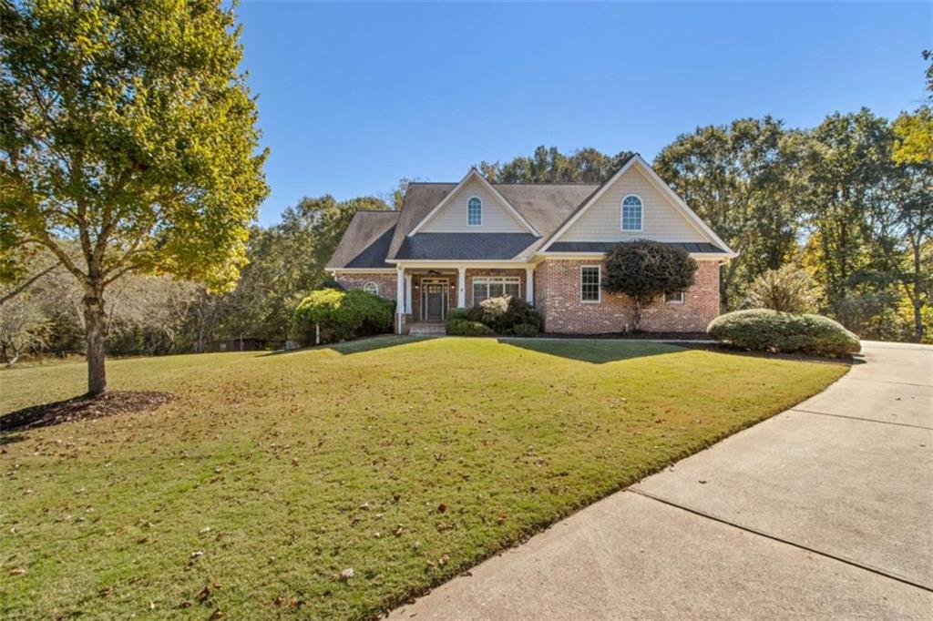 94 Appalachee Church Road Auburn, GA 30011 - Photo 2 of 66 a front view of a house with yard and tree