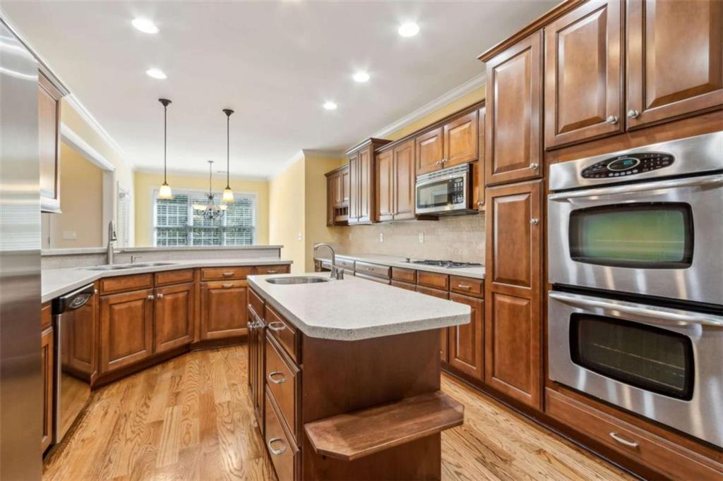 94 Appalachee Church Road Auburn, GA 30011 - Photo 22 of 66 a kitchen with stainless steel appliances granite countertop a sink stove and microwave