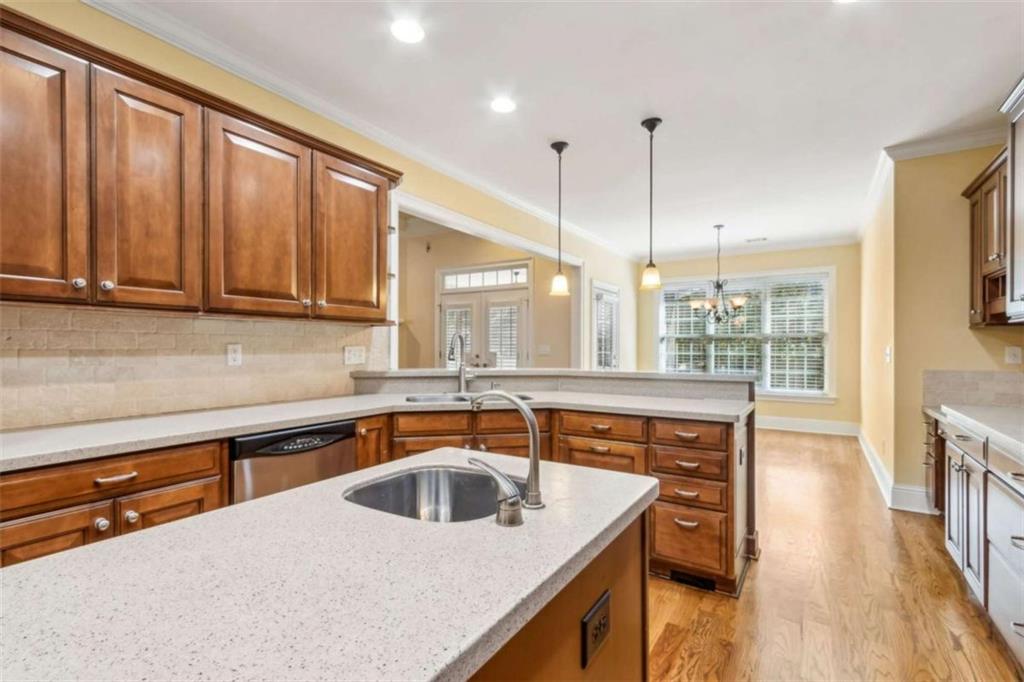 94 Appalachee Church Road Auburn, GA 30011 - Photo 23 of 66 a kitchen with stainless steel appliances granite countertop a sink a stove and a wooden cabinets