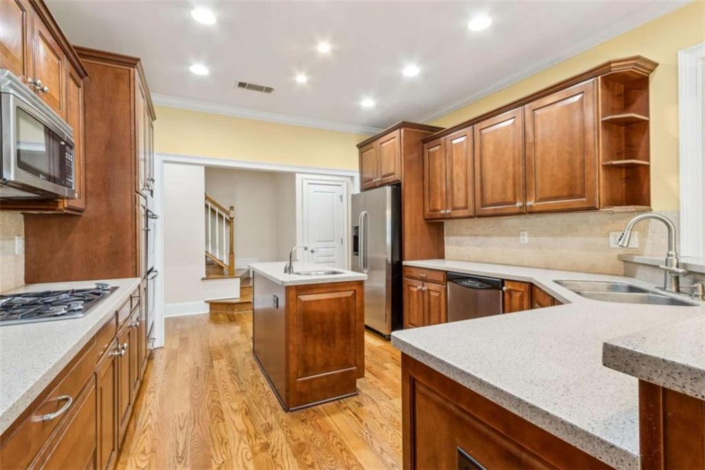 94 Appalachee Church Road Auburn, GA 30011 - Photo 25 of 66 a kitchen with stainless steel appliances granite countertop a sink stove and refrigerator