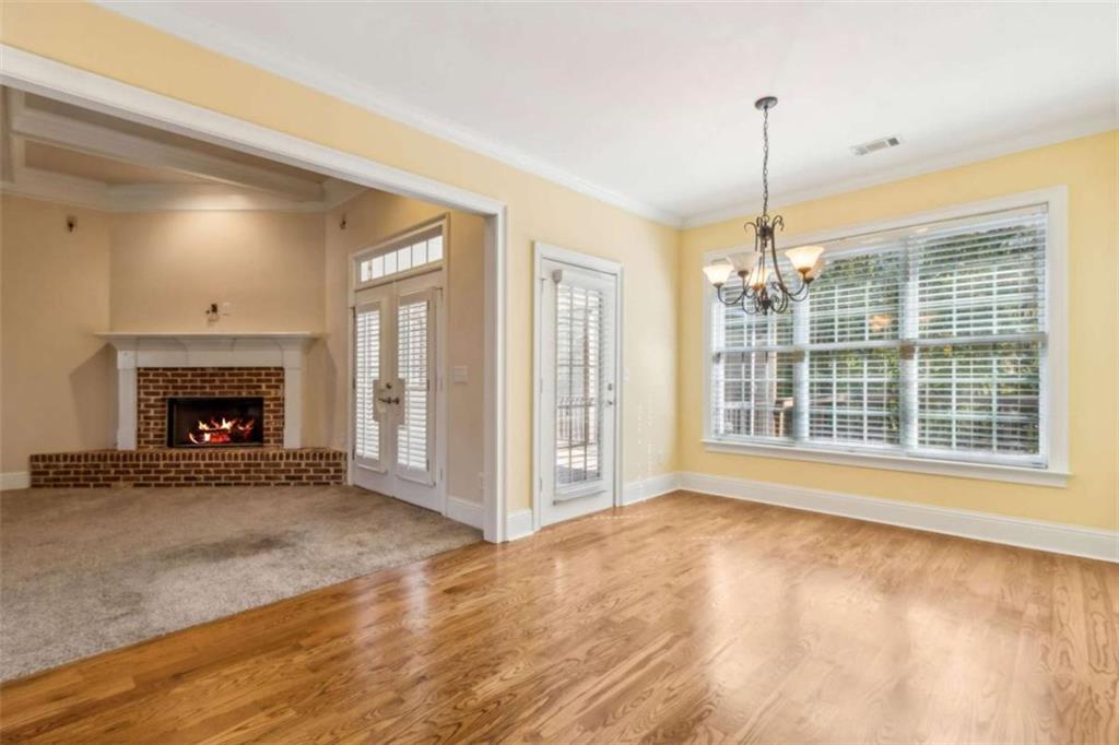 94 Appalachee Church Road Auburn, GA 30011 - Photo 28 of 66 a view of an empty room with a fireplace and a window