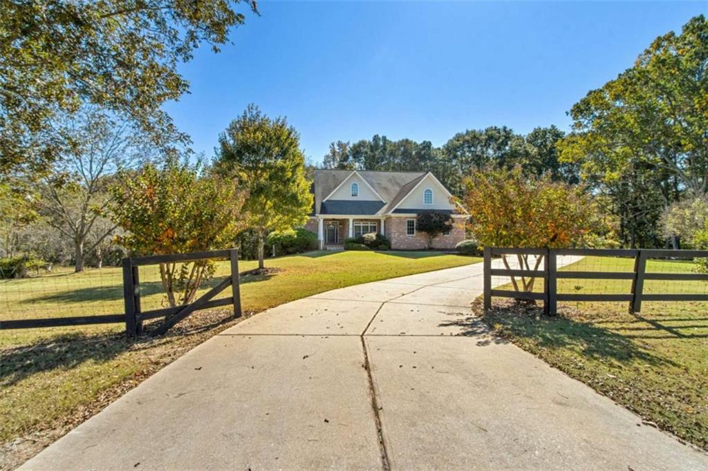 94 Appalachee Church Road Auburn, GA 30011 - Photo 3 of 66 a house with trees in front of it