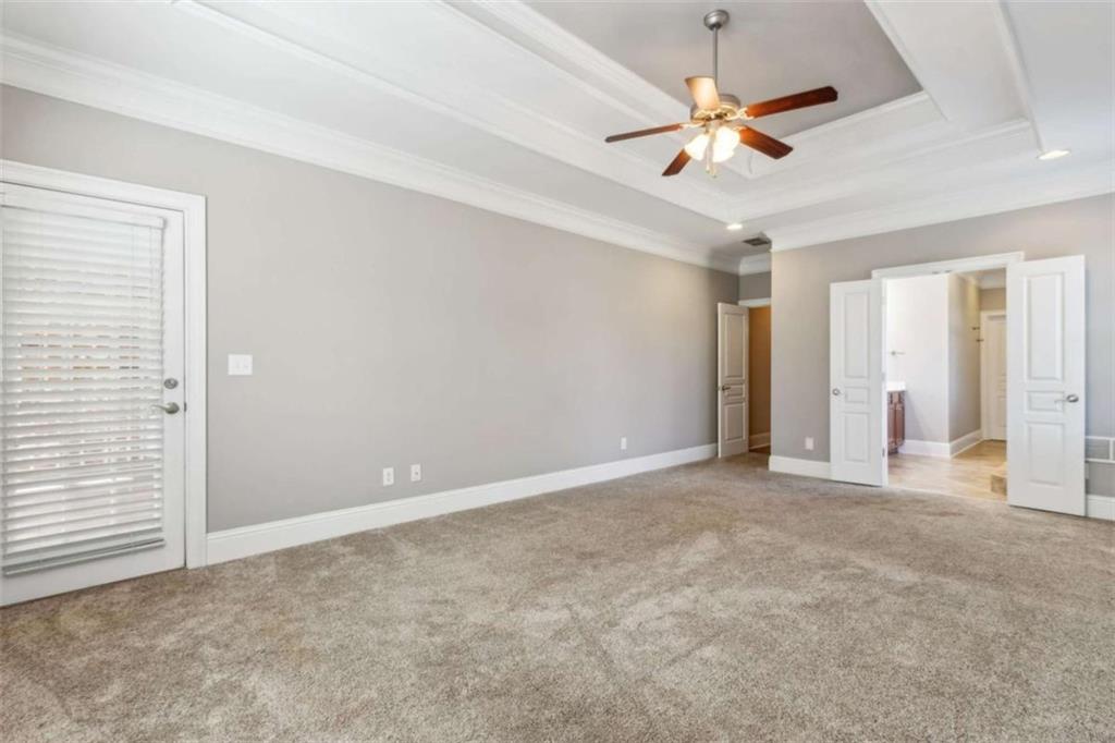 94 Appalachee Church Road Auburn, GA 30011 - Photo 34 of 66 an empty room with closet and a ceiling fan