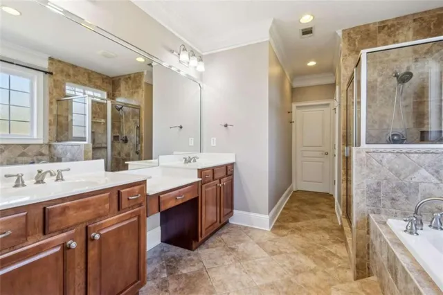 a spacious bathroom with a granite countertop sink toilet and shower