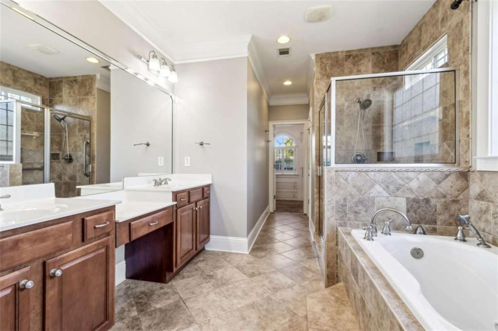 94 Appalachee Church Road Auburn, GA 30011 - Photo 38 of 66 a bathroom with a tub sink shower and mirror