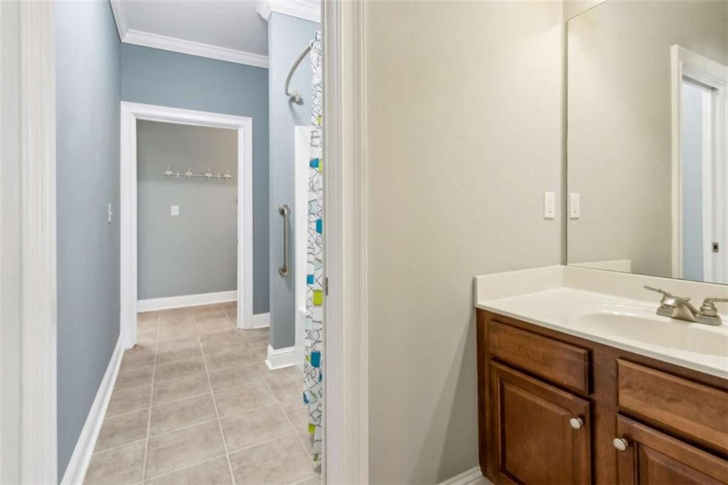 94 Appalachee Church Road Auburn, GA 30011 - Photo 43 of 66 a bathroom with a sink and a mirror