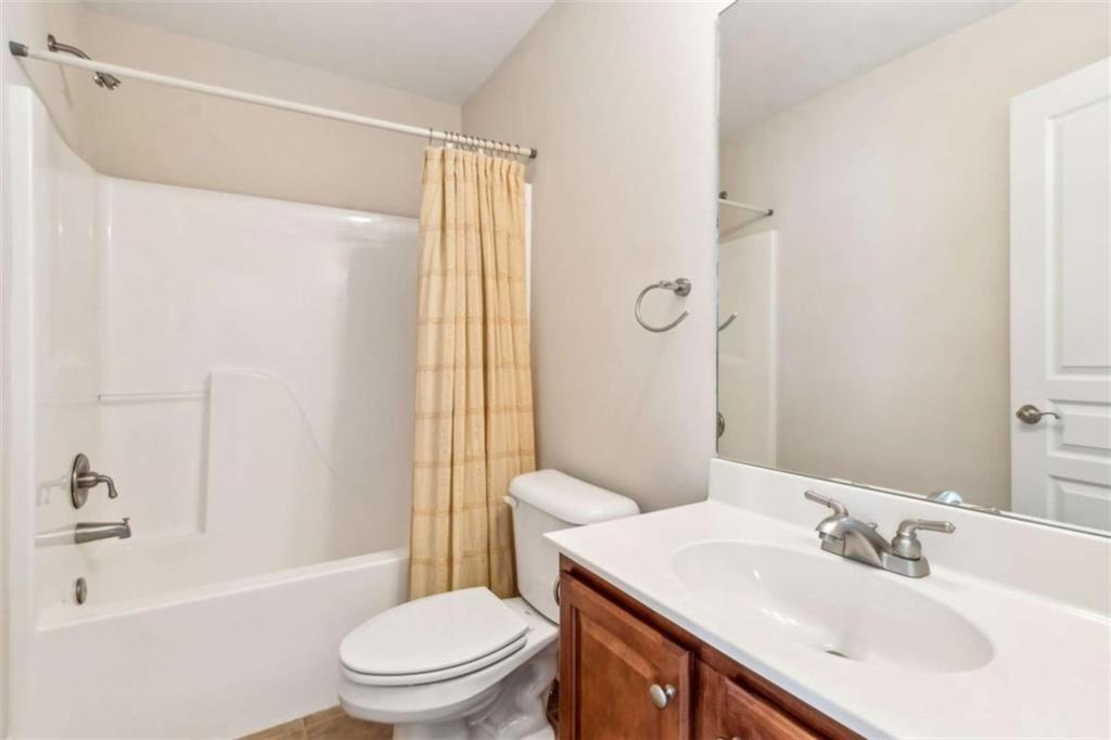 94 Appalachee Church Road Auburn, GA 30011 - Photo 52 of 66 a bathroom with a sink toilet and shower