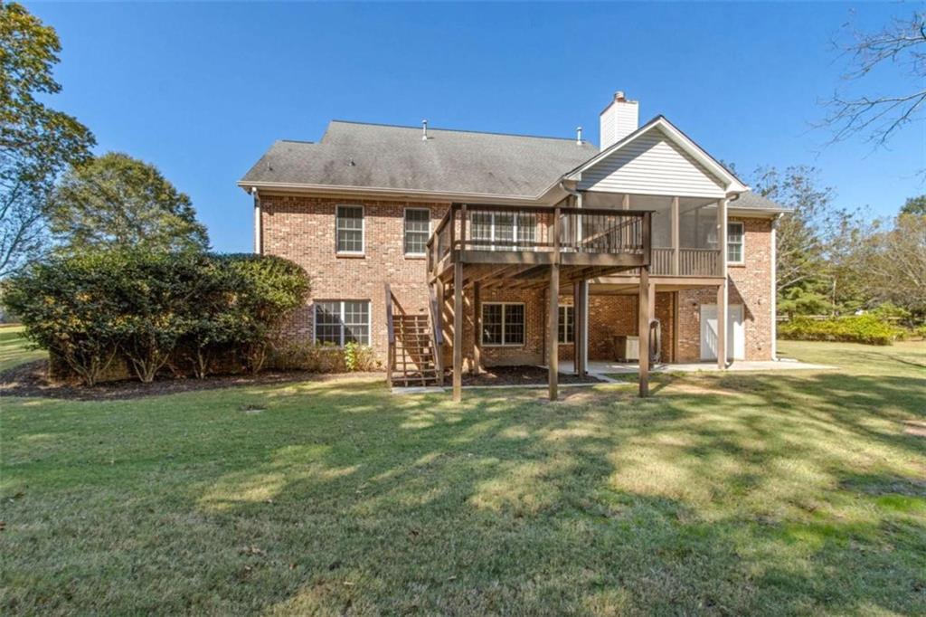 94 Appalachee Church Road Auburn, GA 30011 - Photo 62 of 66 a view of a house with a yard and large tree
