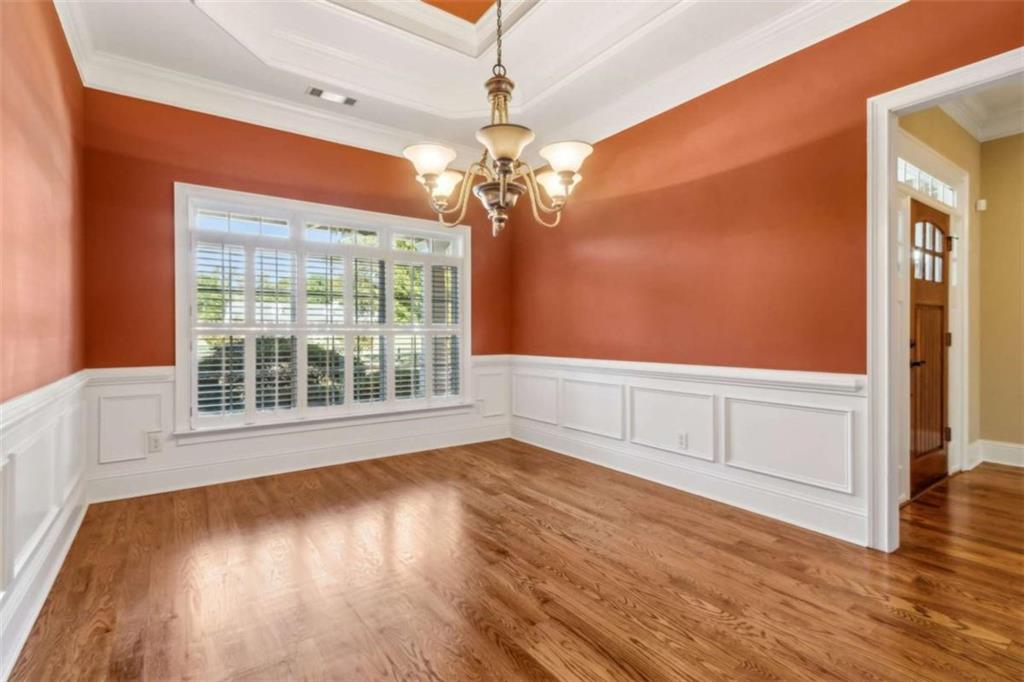 94 Appalachee Church Road Auburn, GA 30011 - Photo 10 of 66 a view of an empty room with wooden floor and a window