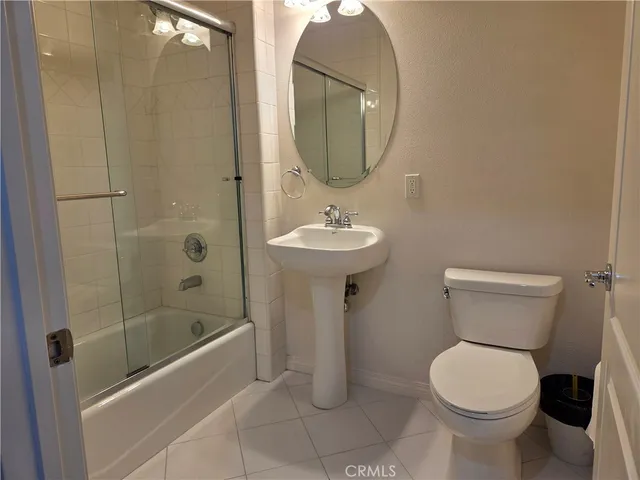a view of a refrigerator in kitchen and wooden floor