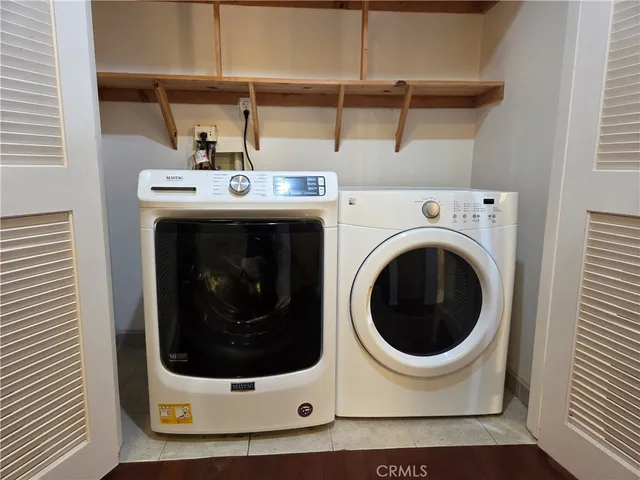 a building outdoor space with patio furniture and potted plants