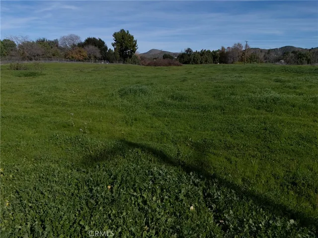 a view of a road with a yard