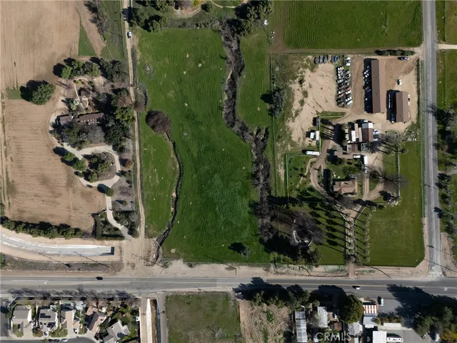 an aerial view of a residential building with outdoor space