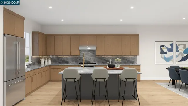 a kitchen with granite countertop a sink and cabinets