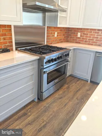 a kitchen with a stove and a microwave