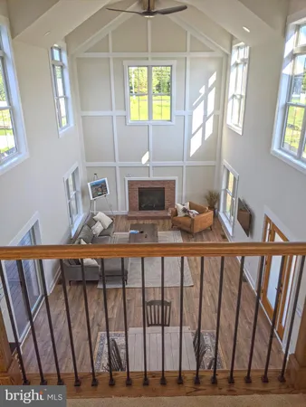 a living room with furniture fireplace and flat screen tv