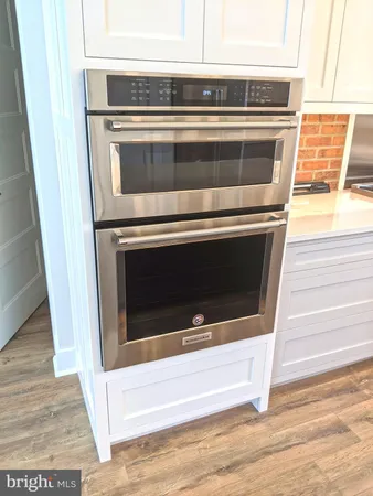 a kitchen with granite countertop a stove and a sink