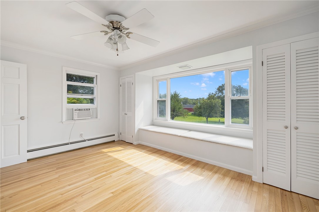 331 3rd Beach Road Middletown, RI 02842 - Photo 32 of 50 Primary bedroom overlooking a private backyard