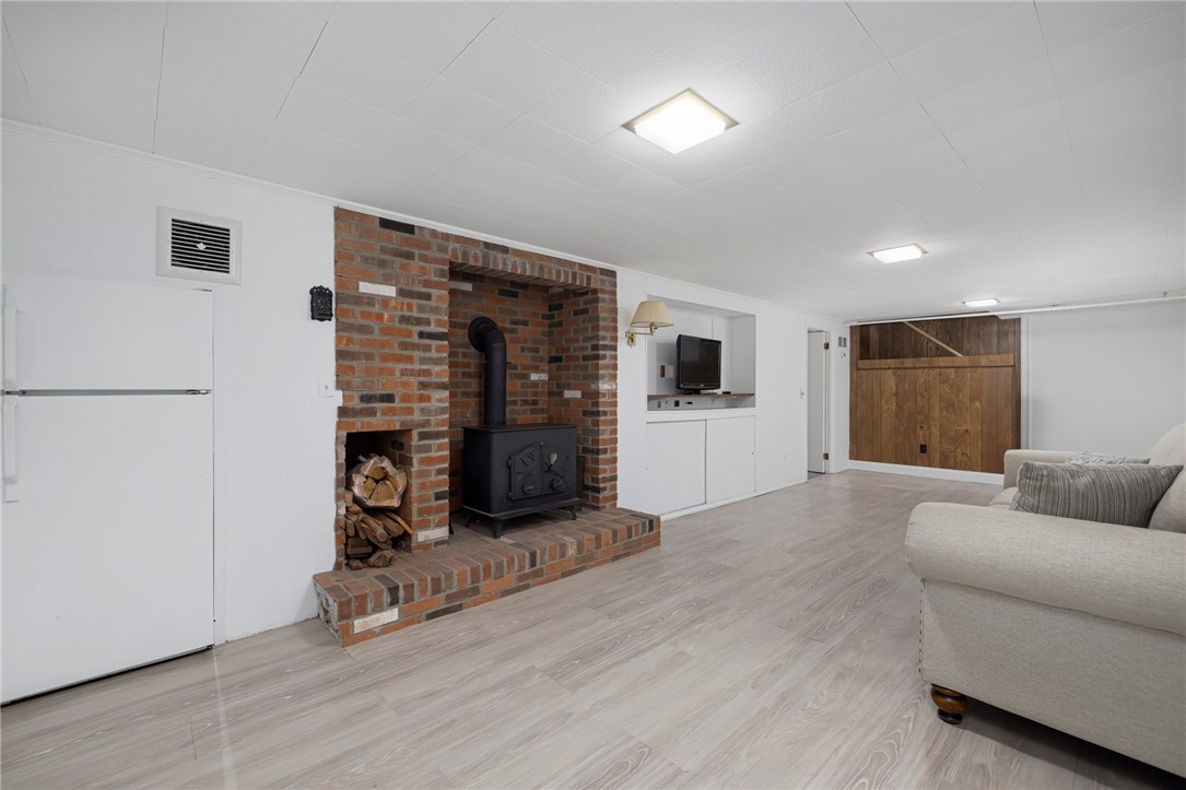 331 3rd Beach Road Middletown, RI 02842 - Photo 41 of 50 Engineered wood floors wood-burning fireplace