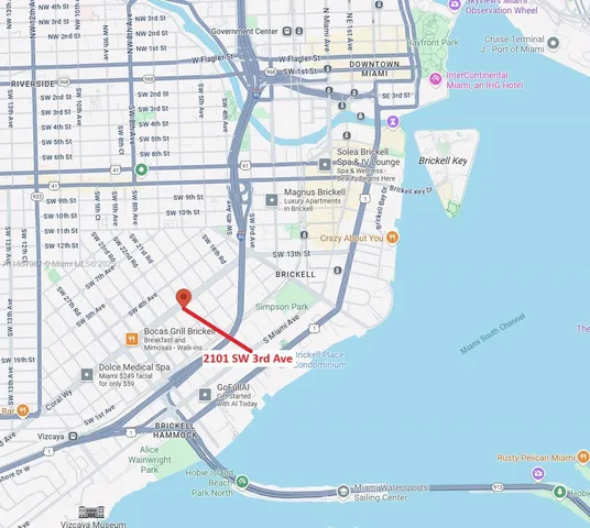 a white building with a sink and windows