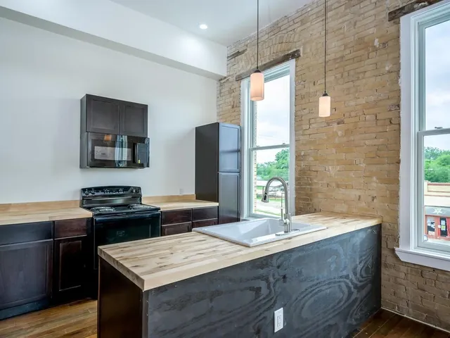 a kitchen with a sink and a stove