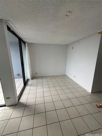 a view of an empty room and entryway