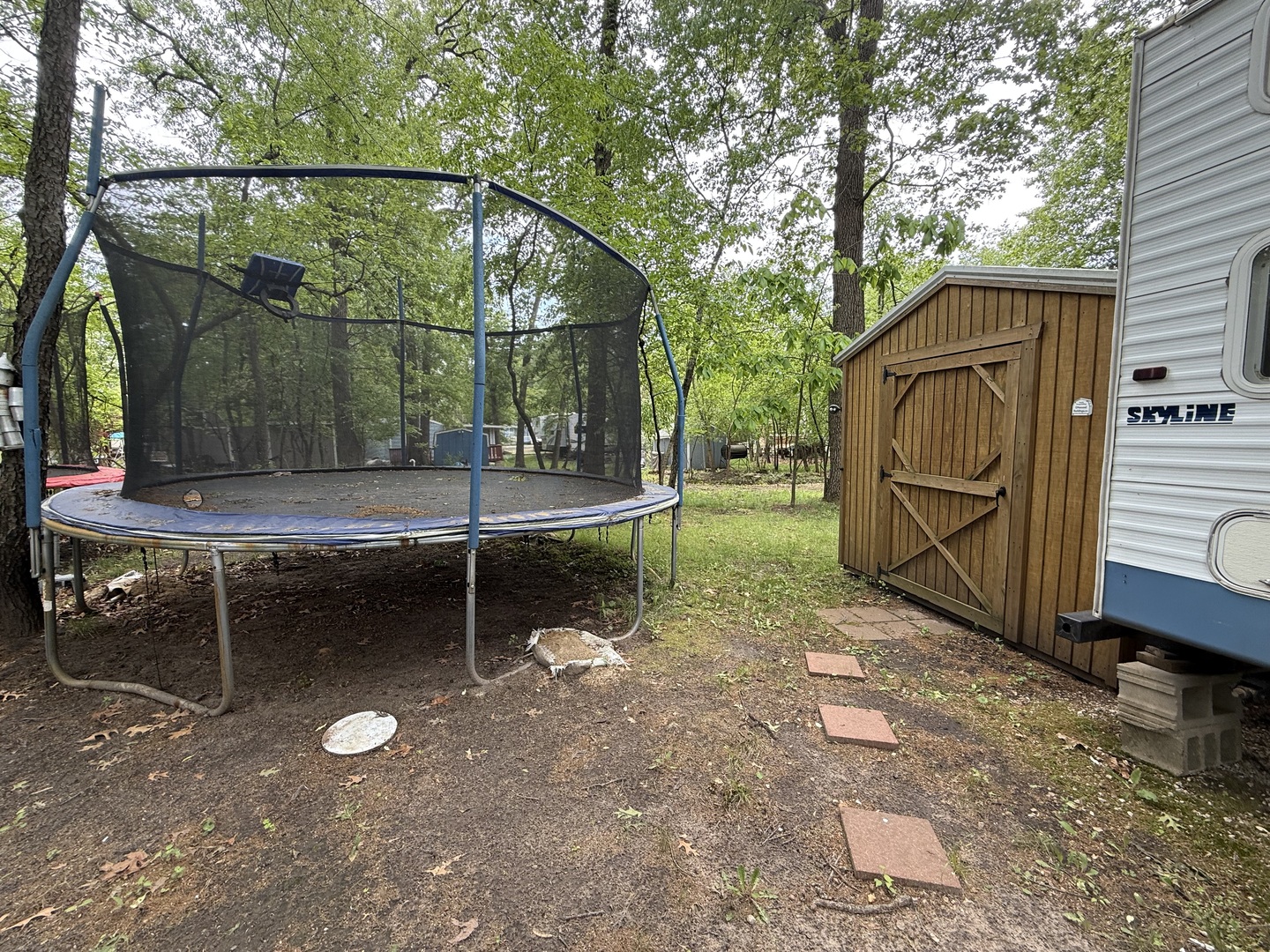 21-191 Woodhaven Lakes Sublette, IL 61367 - Photo 15 of 22 a backyard of a house with barbeque oven and wooden fence