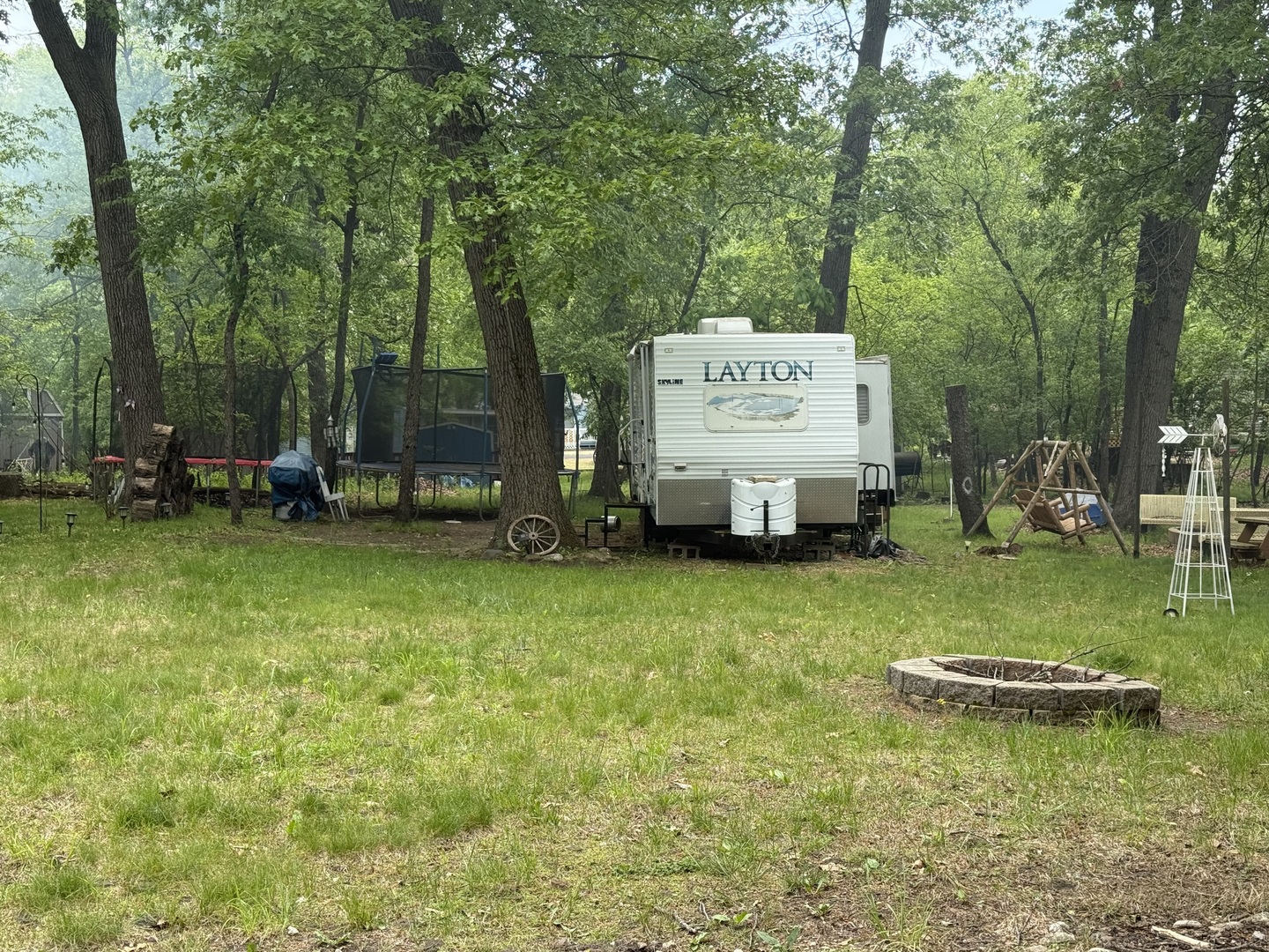 21-191 Woodhaven Lakes Sublette, IL 61367 - Photo 2 of 22 swimming pool view with a seating space and a forest view
