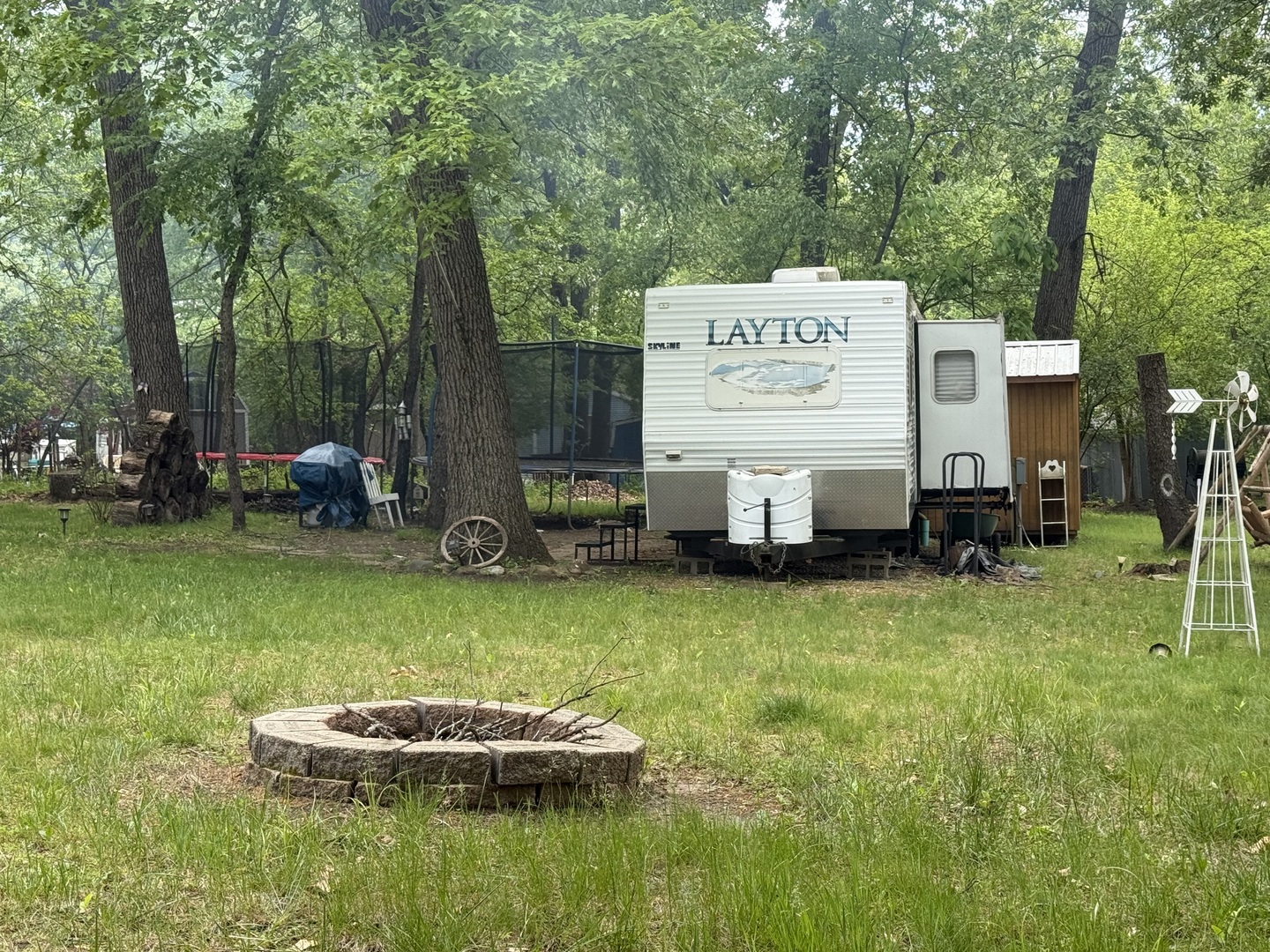 21-191 Woodhaven Lakes Sublette, IL 61367 - Photo 22 of 22 a view of a house with backyard swimming pool and sitting area